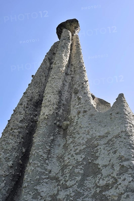 Pyramids of Euseigne, Valais, Wallis, Switzerland. Rocks of harder stone stacked on top of conglomerate due to water erosion