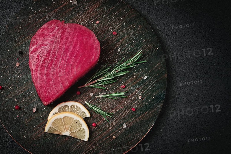 Fresh red tuna fillet, for steak, raw, top view, on a cutting board, no people