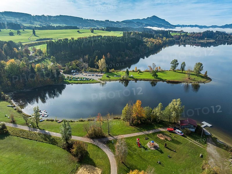 Sports facility and bathing area, lake Rottachsee, at village Petersthal, mt. Gruenten in the back, autumn, aerial view, Allgaeu, Bavaria, Germany, Europe