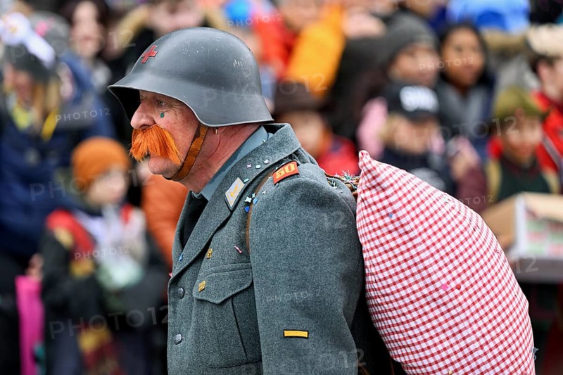 Person masked as a soldier HD-Läppli at the carnival parade of the Wey guild on Rose Monday, Güdismäntig, Lucerne Carnival 2024, Lucerne, Switzerland, Europe