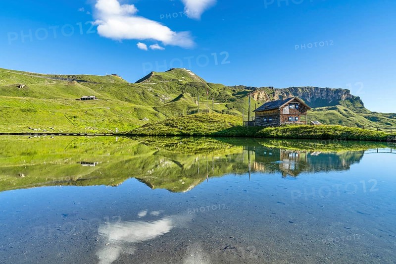Hut at Fuscher Lacke, Edelweißspitz in the background, blue sky, reflection, Grossglockner High Alpine Road, Hohe Tauern National Park, Pinzgau, Salzburg