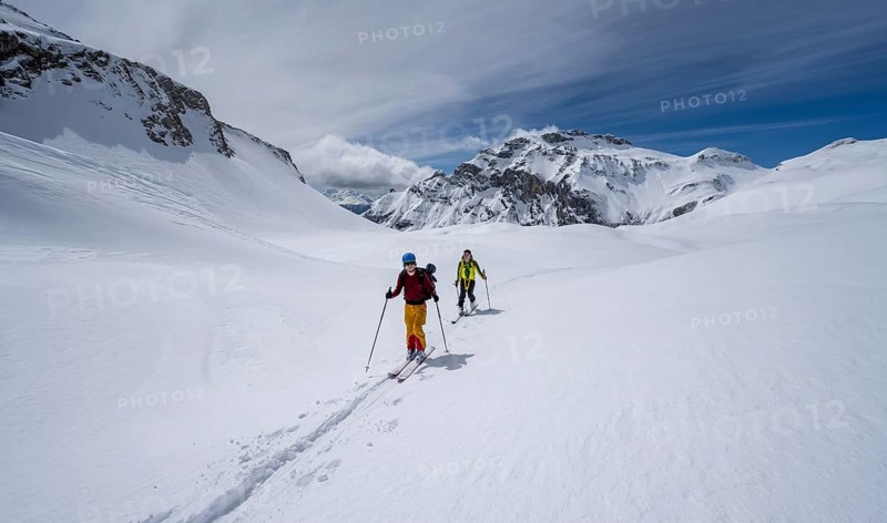 Ski tourers in a mountain landscape with snow, summit Wildhorn in the background, ascent to Wildstrubelhütte, Bernese Alps, Switzerland, Europe