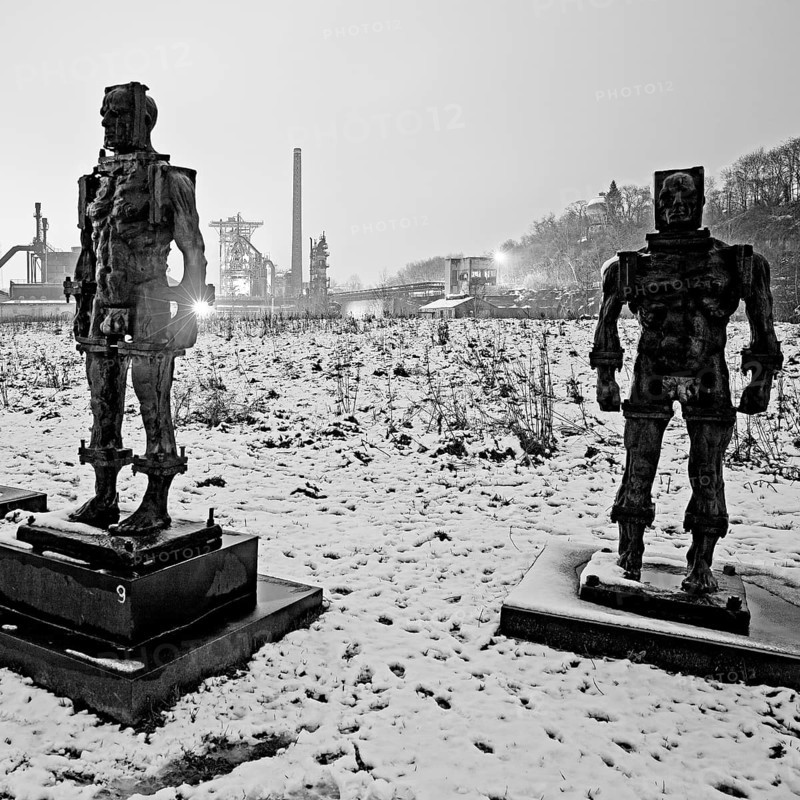 People made of iron, multi-part iron sculpture by Zbigniew Fraczkiewicz in front of the Henrichshütte in winter, Hattingen, Ruhr area, Germany, Europe