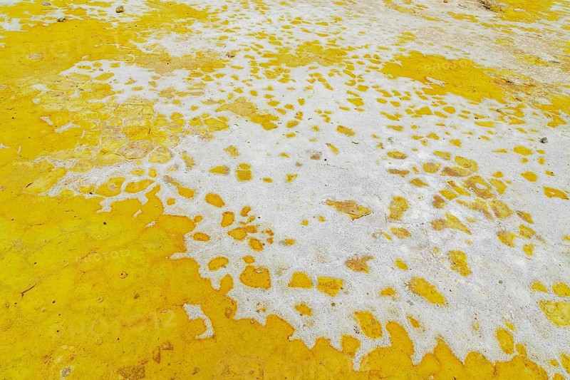 Splashes of sulphur colouring Stefanos crater ground, Nisyros Island, Dodecanese Islands, Greece, Europe