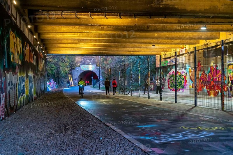 The Nordbahntrasse, a cycle path, footpath, on a former 22 km long railway line, along the west-east axis of Wuppertal, on the northern slope, with many tunnels, viaducts and views of the city, graffiti and basketball area at Brill, Wuppertal, North Rhine-Westphalia, Germany, Europe