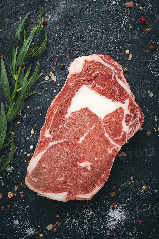 Fresh, raw rib eye steak, top view