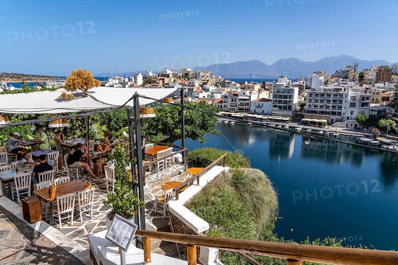 Taverna Gioma above the village of Agios Nikolaos, in the eastern part of Crete, view over Lake Voulismeni, connected to the sea, old town, Greece, Europe
