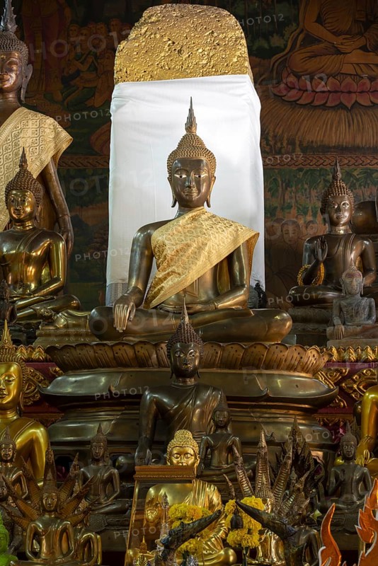 Numerous Buddhas and the city pillar, which is considered the home of the city's protective spirit, Wat Si Muang temple complex, Vientiane, Laos, Asia