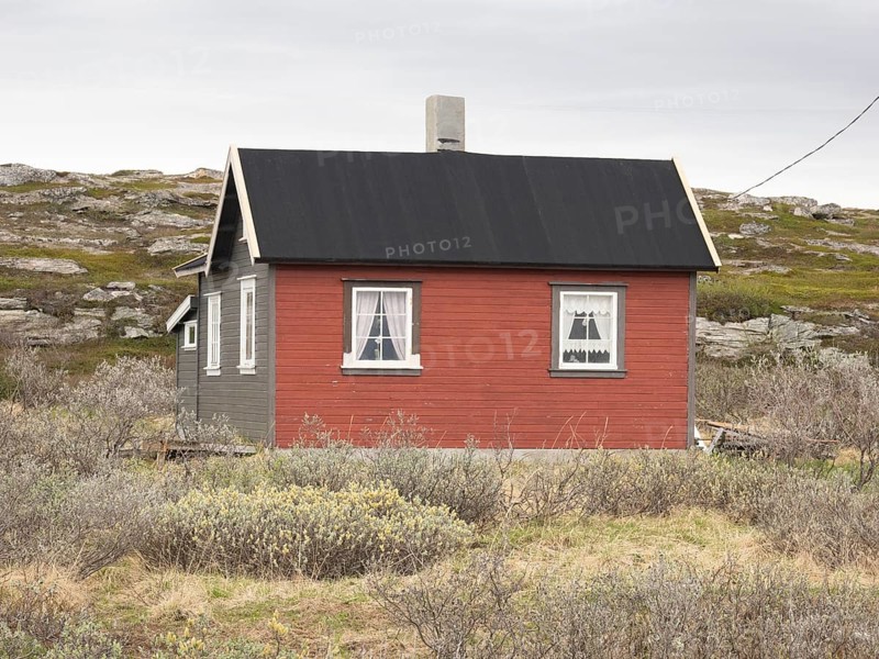 Holiday home on the shore of the Arctic Ocean, beside the town of Nesseby, May, Varangerfjord, Finnmark, Norway, Europe