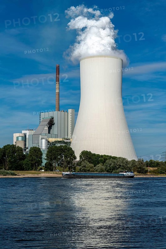 Cooling tower of the coal-fired power plant Duisburg-Walsum, operated by STEAG and EVN AG, 181 metres high, power plant unit 10, water vapour cloud, container cargo ship on the Rhine, Duisburg, North Rhine-Westphalia, Germany, Europe