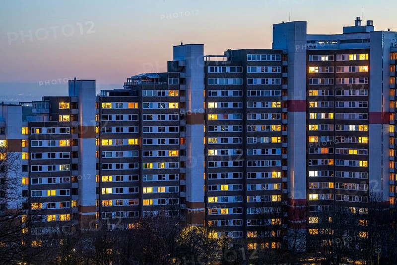 High-rise buildings in the Bensberg residential park, Bergisch-Gladbach, 18-storey housing estate with over 900 flats spread over 7 building complexes, dusk, illuminated windows, North Rhine-Westphalia, Germany, Europe