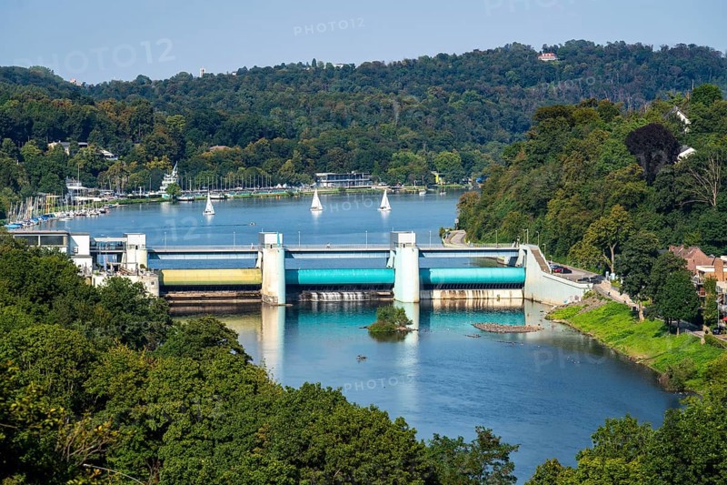 Lake Baldeney, a Ruhr reservoir, dam wall, with hydroelectric power plant power station, behind the regatta tower with grandstands, in Essen, North Rhine-Westphalia, Germany, Europe