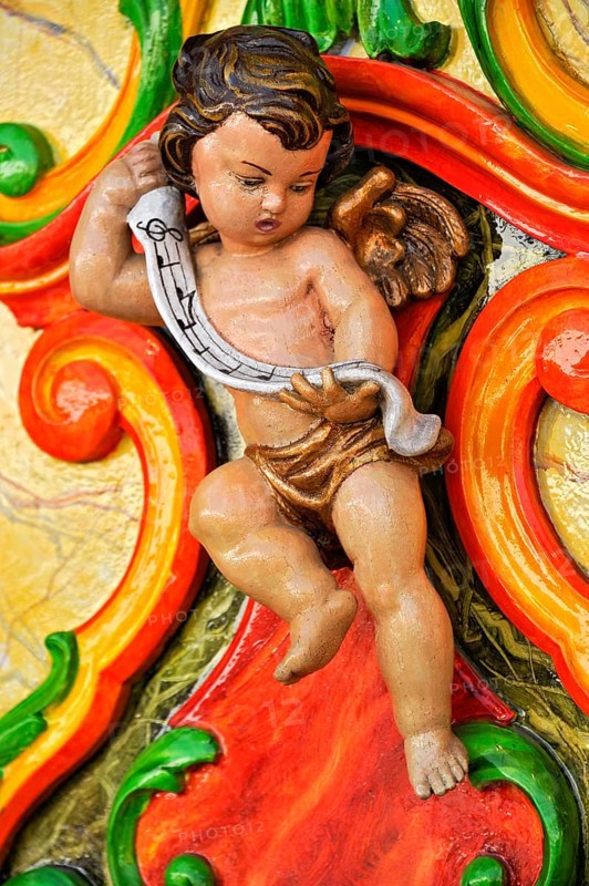 Wooden figure, colourfully painted, cherub at a carousel organ, fairground organ, historic Oktoberfest, Oktoberfest, Munich, Upper Bavaria, Bavaria, Germany, Europe