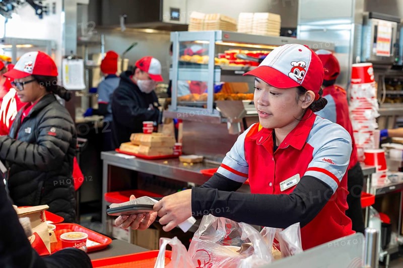 Sterling Heights, Michigan, Workers serve up Chickenjoy fried chicken at Jollibee, a Filipino fast food chain. Jollibee is called the McDonald's of the Philippines. It has 1400 stores worldwide. This one is the first location in Michigan. The chain focuses on locations with many Filipino-Americans