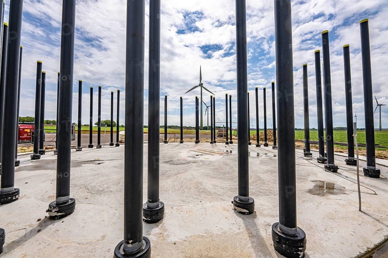 Wind turbine repowering, in the Issum-Oermten wind farm, 9 wind turbines in operation for over 20 years (Enercon model series E-58) in the background are replaced by 4 new turbines (type Enercon E-160), foundation, which then generate 4 times more electricity than the old 9 wind turbines, North Rhine-Westphalia, Germany, Europe