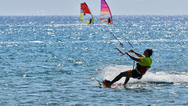 Kitesurfer rides over the sea in sunny weather, surfer's paradise, kitesurfer, windsurfer, Prasonisi, island in the south of Rhodes, Rhodes, Dodecanese, Greek Islands, Greece, Europe