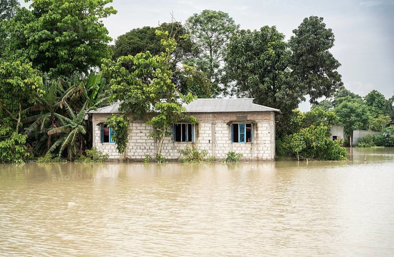 Morigaon, India. 4 July 2024. A flooded house, in a flood affected village in Morigaon district in India's northeastern state of Assam on July 4, 2024. Torrential rains and surging rivers across northeast India have killed at least nine people, with more than 1.5 million people affected