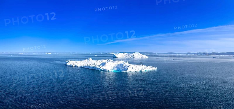 Iceberg seen from cruise ship vacation in Greenland coast in Arctic circle near Ilulissat Disko Bay