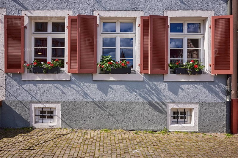 Windows with shutters and flower boxes on a house in Gengenbach, Black Forest, Ortenaukreis, Baden-Württemberg, Germany, Europe