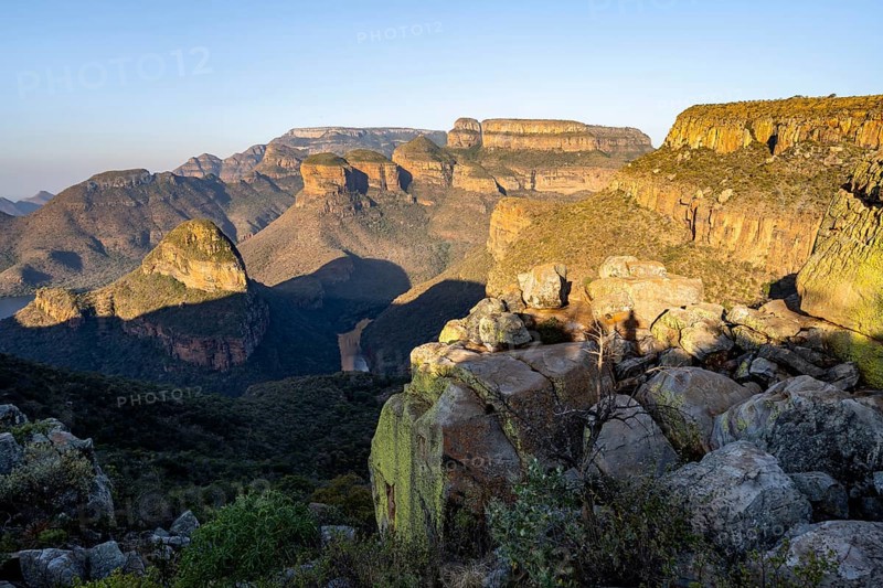 Sunset at Blyde River Canyon with Three Rondawels peak, view of canyon with Blyde River and Mesa mountains in the evening light, Upper Viewpoint, canyon landscape, Panorama Route, Mpumalanga, South Africa, Africa