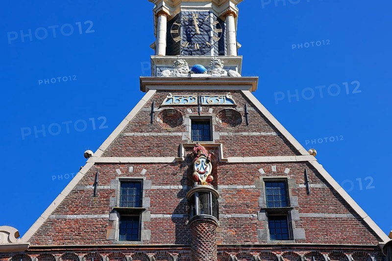 City coat of arms with unicorn and post horn on the historic Hoofdtoren defence defence tower in the harbour of Hoorn, Markermeer, part of the IJsselmeer, province of North Holland, West Friesland, Netherlands