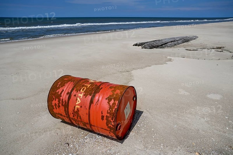 Washed up oil drum on the beach, Loango National Park, Parc National de Loango, Ogooué-Maritime Province, Gabon, Africa