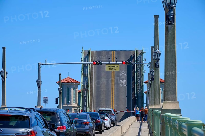 Traffic light, drawbridge and cars, with a sign, Bridge of Lions and raised bridge, St. Augustine, Florida, USA, North America
