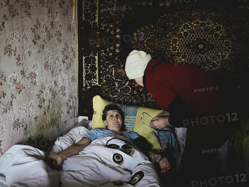 Tryohizbenka, Ukraine, Lilia Schwez on a visit to Valentina, 75, in the morning there were several grenade explosions, she got palpitations and high blood pressure, the repeated shelling of her house traumatised her, Tryohizbenka, Ukraine, Europe