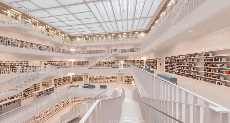 Modern, bright library with open staircases and many bookshelves in a symmetrical arrangement, public library am Mailänder Platz, empty, Stuttgart, Germany, Europe