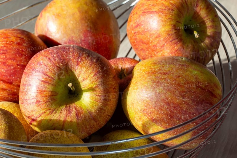 Close-up of apples and pears in the fruit basket