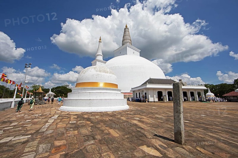 Sri Lankan pilgrims at the white stupa in the holy city of Anuradhapura, North Central Province, Sri Lanka, Asia
