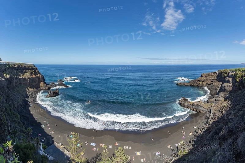 The lava beach lined with bathers, Playa del Bollulo, near Puerto de la Cruz, Tenerife, Canary Islands, Spain, Europe