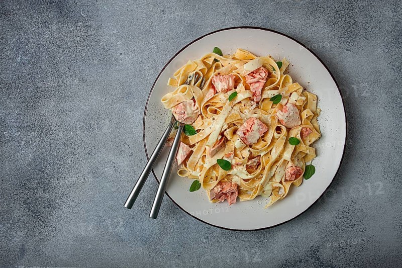 Tagliatelle pasta, in cream sauce with salmon, homemade, no people