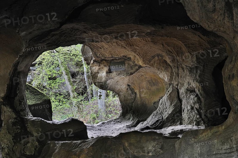 The Hohllay cave showing grooves and circles in the sandstone rock from carving millstones, Berdorf, Little Switzerland, Mullerthal, Grand Duchy of Luxembourg
