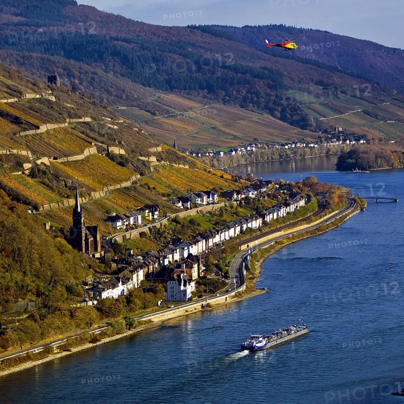 Elevated view of the Rhine and Lorch from Bacharach with barge and helicopter, Upper Middle Rhine Valley, Hesse, Germany, Europe