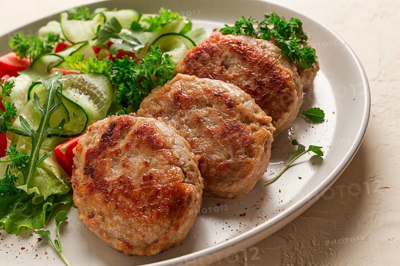 Fried cutlets, turkey, with vegetable salad, top view, no people