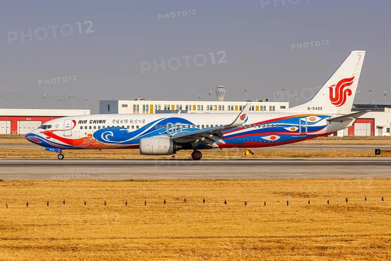 An Air China Boeing 737-800 aircraft with the registration number B-5422 and the Phoenix special livery at Daxing Airport (PKX) in Beijing, China, Asia