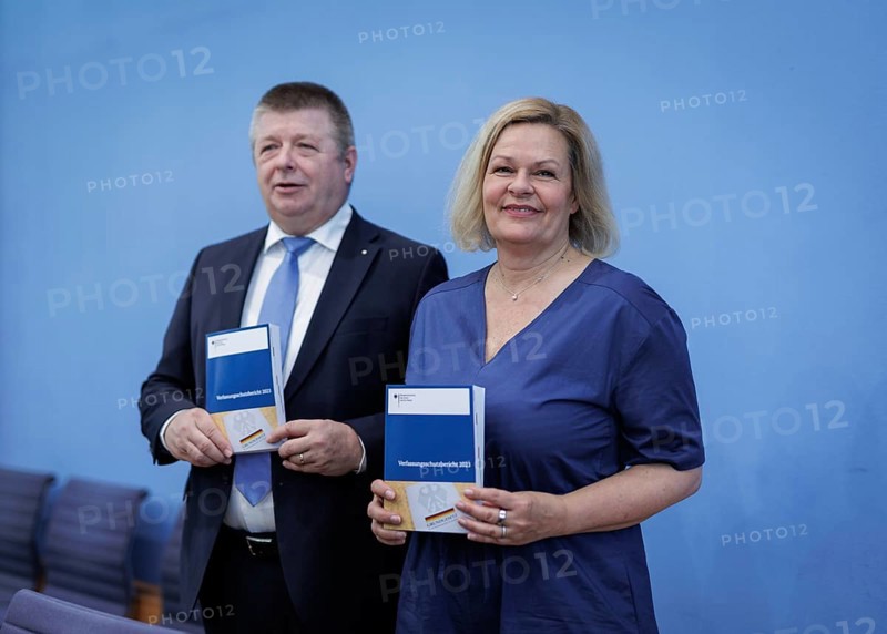 (L-R) Thomas Haldenwang, President of the Federal Office for the Protection of the Constitution, and Nancy Faeser, Federal Minister of the Interior and Home Affairs, recorded during the Federal Press Conference on the presentation of the 2023 Report on the Protection of the Constitution, in Berlin, 18 June 2024