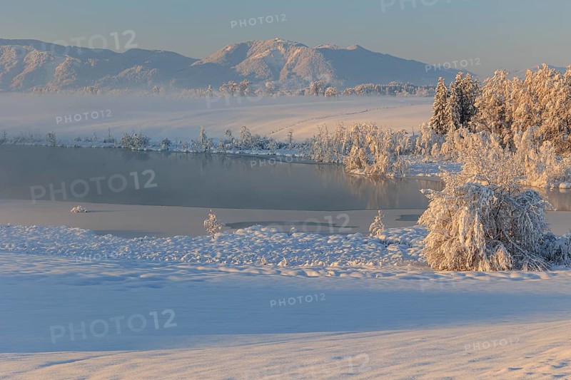 Lake in front of mountains in the morning light, fog, snow, winter, Riegsee, view of Hörnle, foothills of the Alps, Upper Bavaria, Bavaria, Germany, Europe