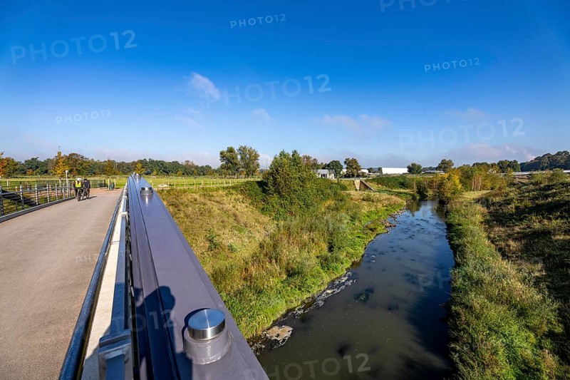 Bridge over the renaturalised Emscher in Emscherland, a new nature and water adventure park at the water crossing of the Emscher with the Rhine-Herne Canal, with lots of nature and recreational areas and information centres on the Emscher conversion and regional nature, North Rhine-Westphalia, Germany, Europe