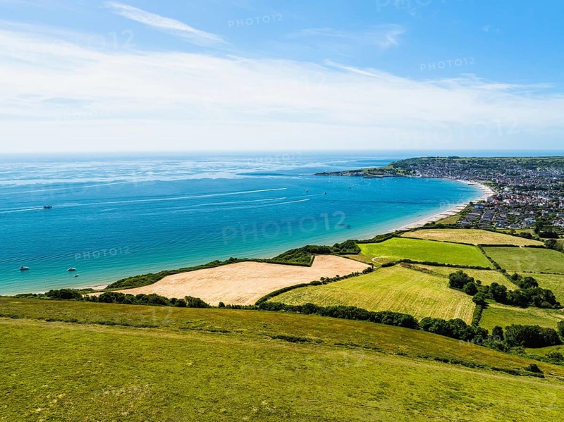 Fields and farms over Swanage and Swanage Bay from a drone, Jurassic Coast, Dorset Coast, Poole, England, United Kingdom, Europe
