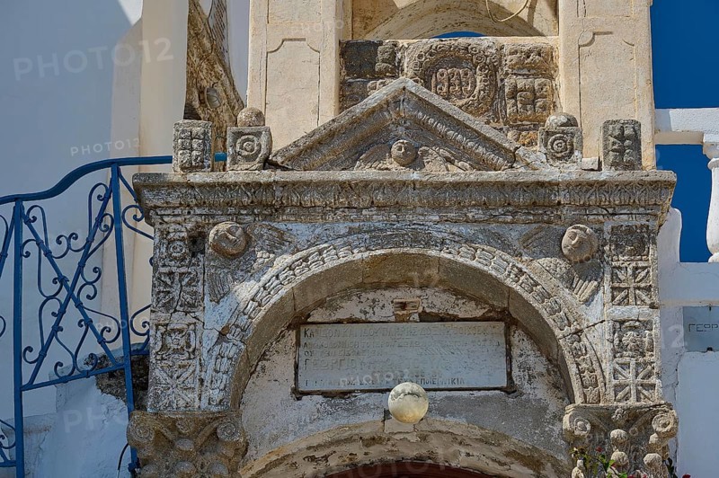 Detailed view of an old stone architecture with engraved decorations and an inscription, Platia and church Issodia Theotokou, Nikia, Nisyros, Dodecanese, Greek Islands, Greece, Europe