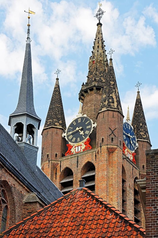 Historic city centre of Delft, Museum Het Prinsenhof in the former Sint Agatha monastery is dominated by the tower of the Gothic Old Church, Oude Kerk, Delft, Zuid-Holland, Netherlands