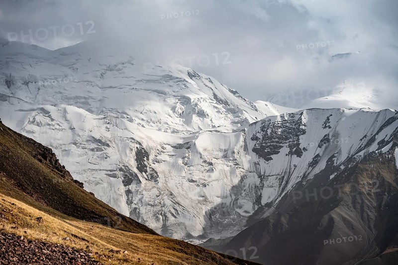 Dramatic mountain landscape, mountain valley, behind glaciated and snow-covered mountain peak Pik Lenin, Trans Alay Mountains, Pamir Mountains, Osh Province, Kyrgyzstan, Asia