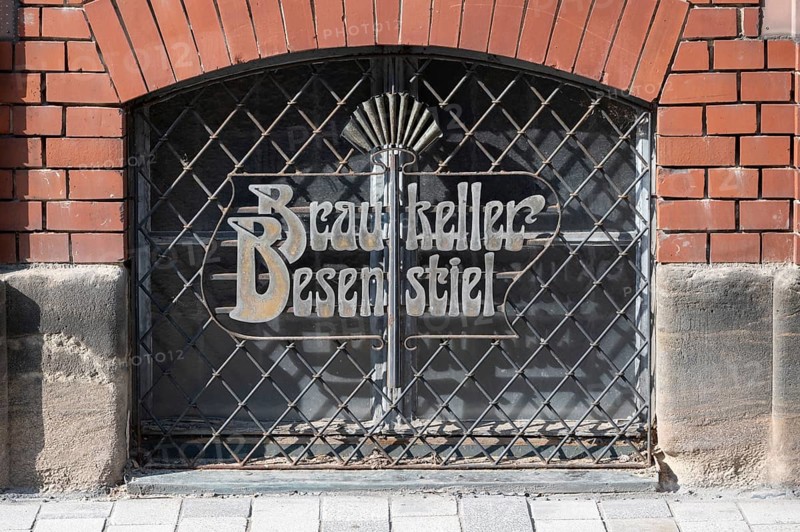 Art Nouveau lettering of a brewery on a barred cellar window, Kulmbach, Upper Franconia, Bavaria, Germany, Europe