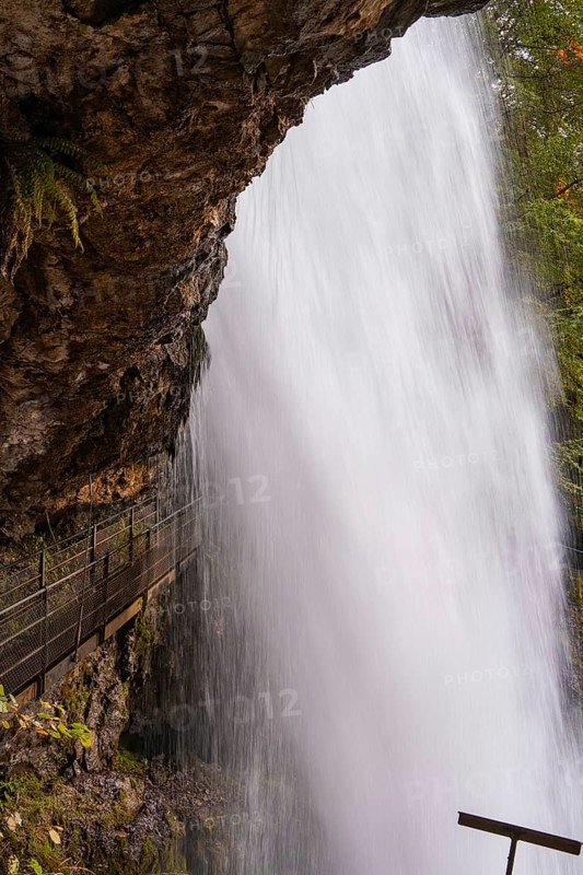 Close-up of a waterfall flowing down next to steep rocks, Lake Brienz, Switzerland, Europe