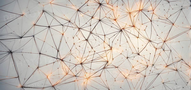 Abstract polygons shifting and rotating seamlessly, connected by glowing lines representing AI networks, vibrant hues, AI generated
