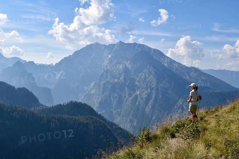 Hiker enjoying the view from the Rossfeldern to the Watzmann, Berchtesgaden National Park, Bavaria, Germany, Europe