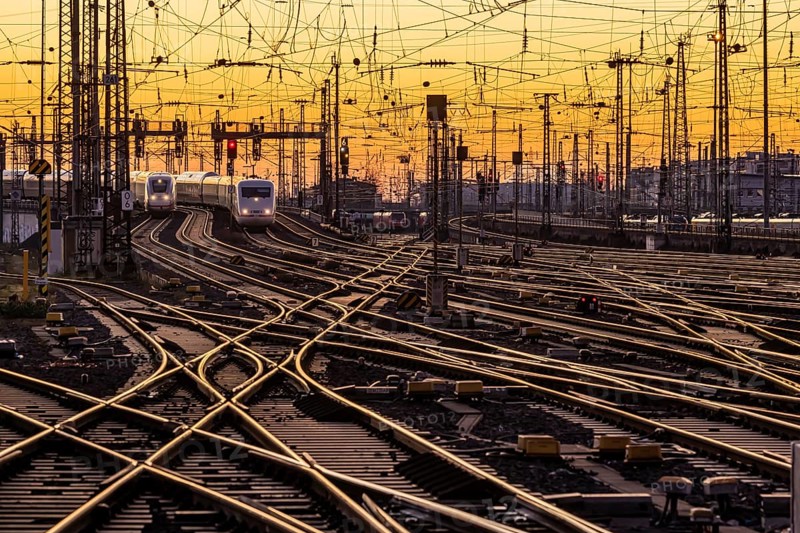 Track apron with trains, rails, points, pylons and signalling systems. Infrastructure at the main station. Sunset. Frankfurt am Main, Hesse, Germany, Europe