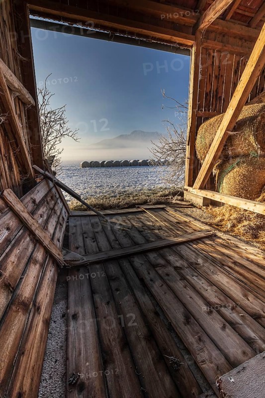 Barn, hut, hay bales, interior shot, morning light, fog, winter, mountains, Loisach-Lake Kochel moor, view of Herzogstand, Alpine foothills, Germany, Europe